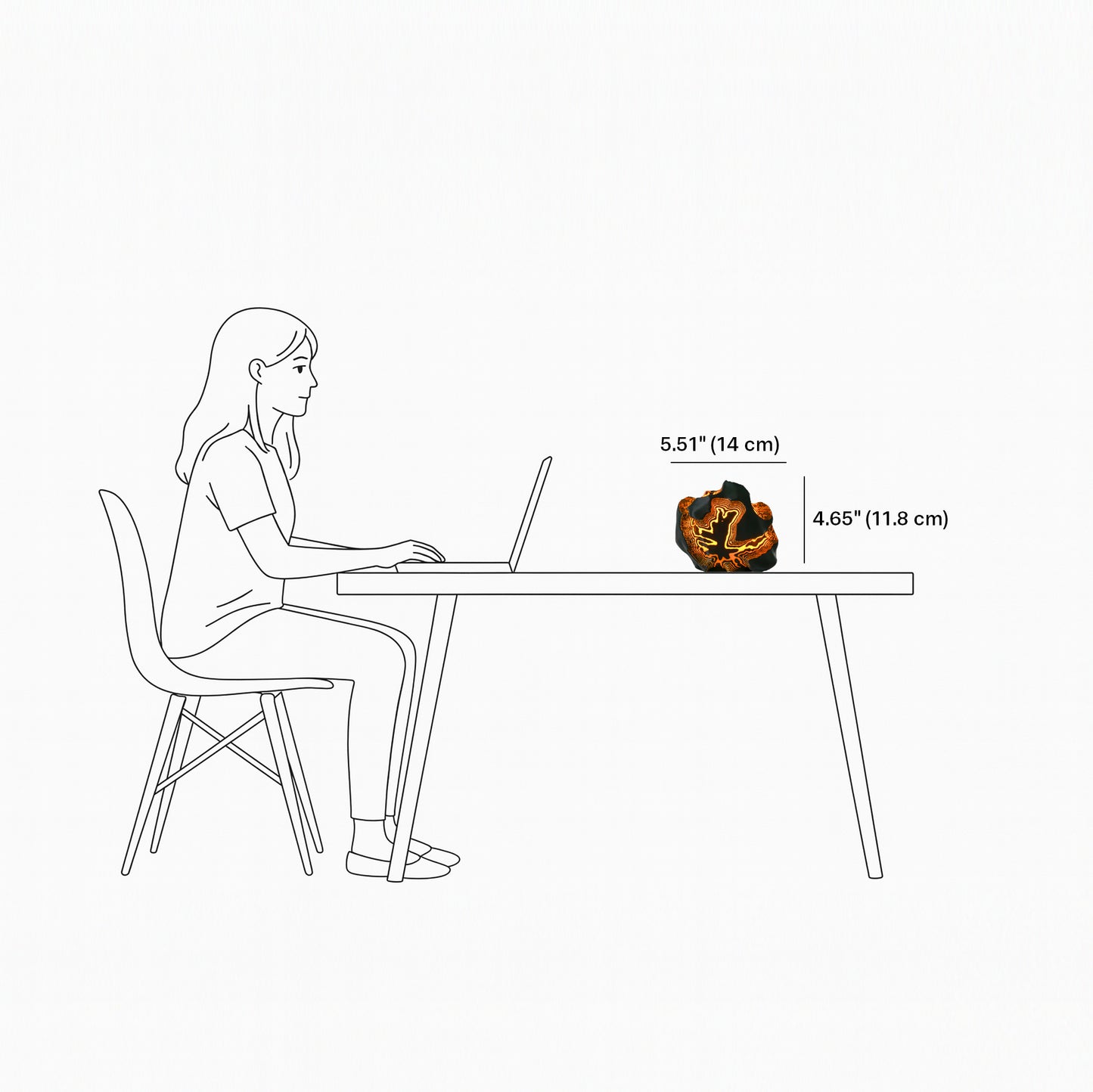 Illustration of a person sitting at a desk with a laptop, showing the size of a lamp on the desk.