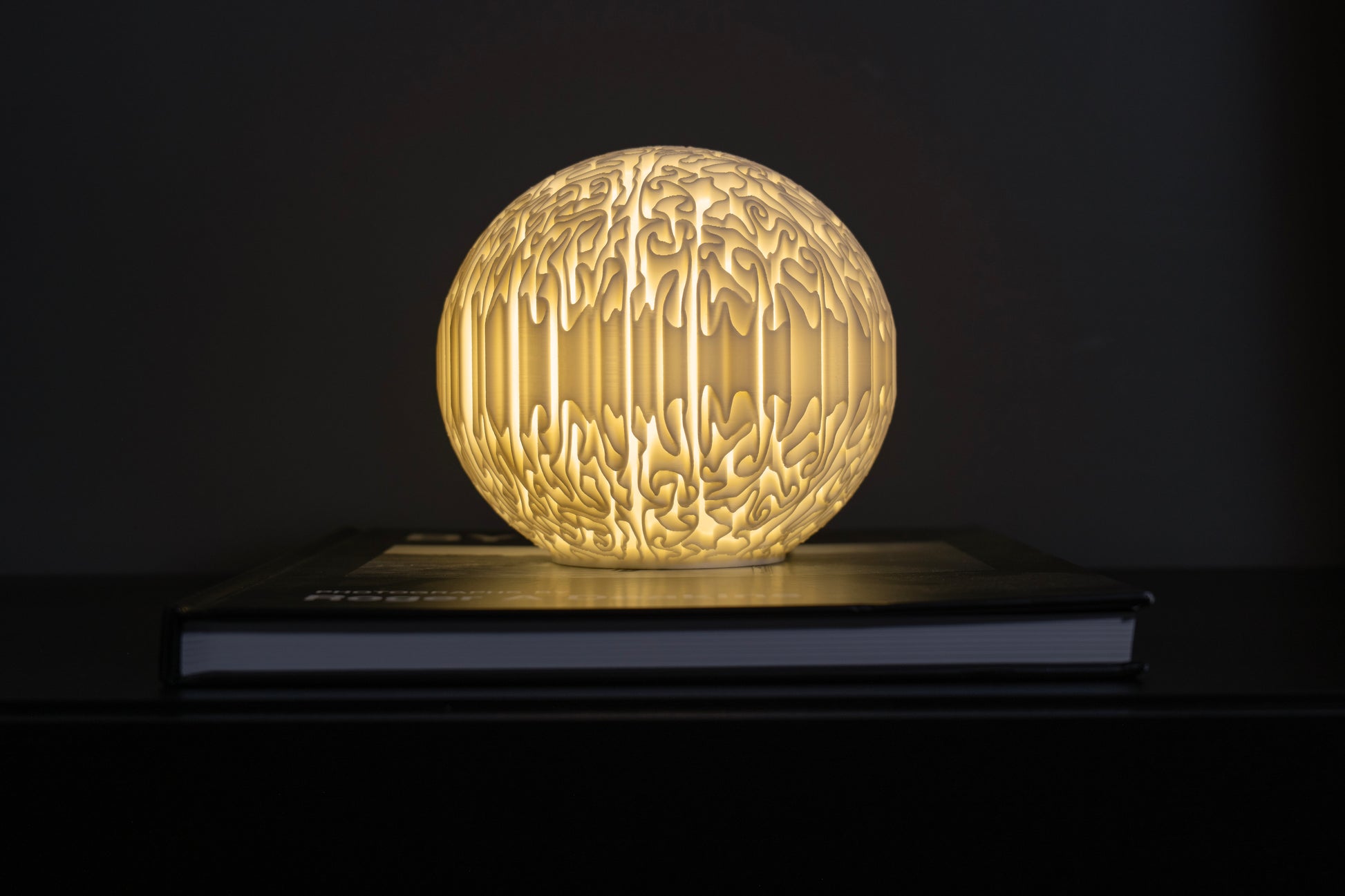 3D printed organic lamp with natural growth pattern texture illuminated softly