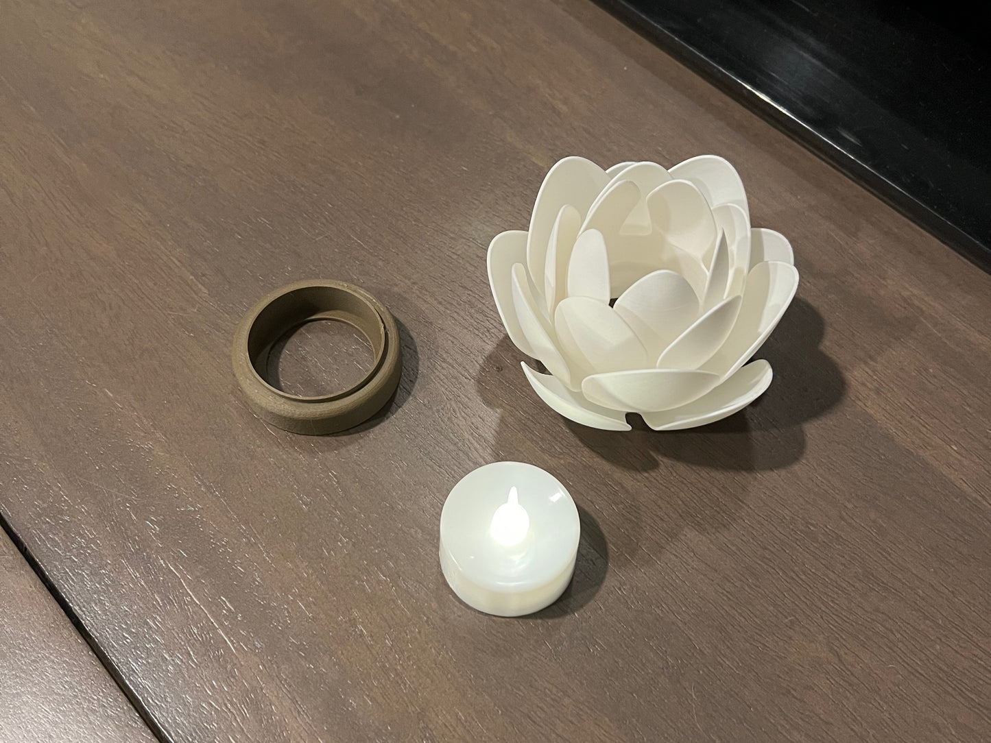 Lotus flower tea light holder with layered petals showing the parts that make up the design