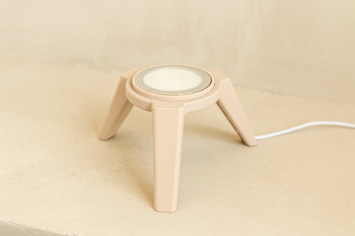 Beige lamp base on a light beige background