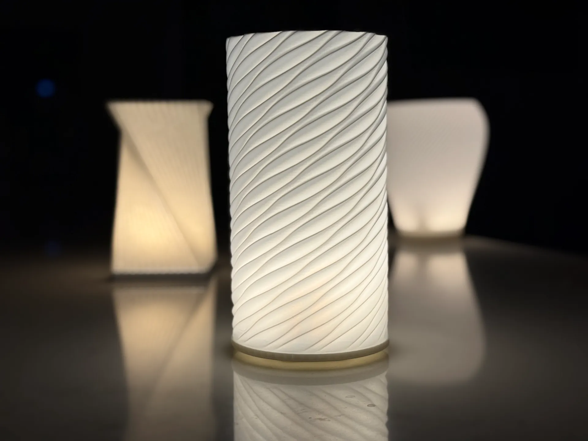 Minimal cylindrical lamp with spiral texture emitting soft diffused warm light